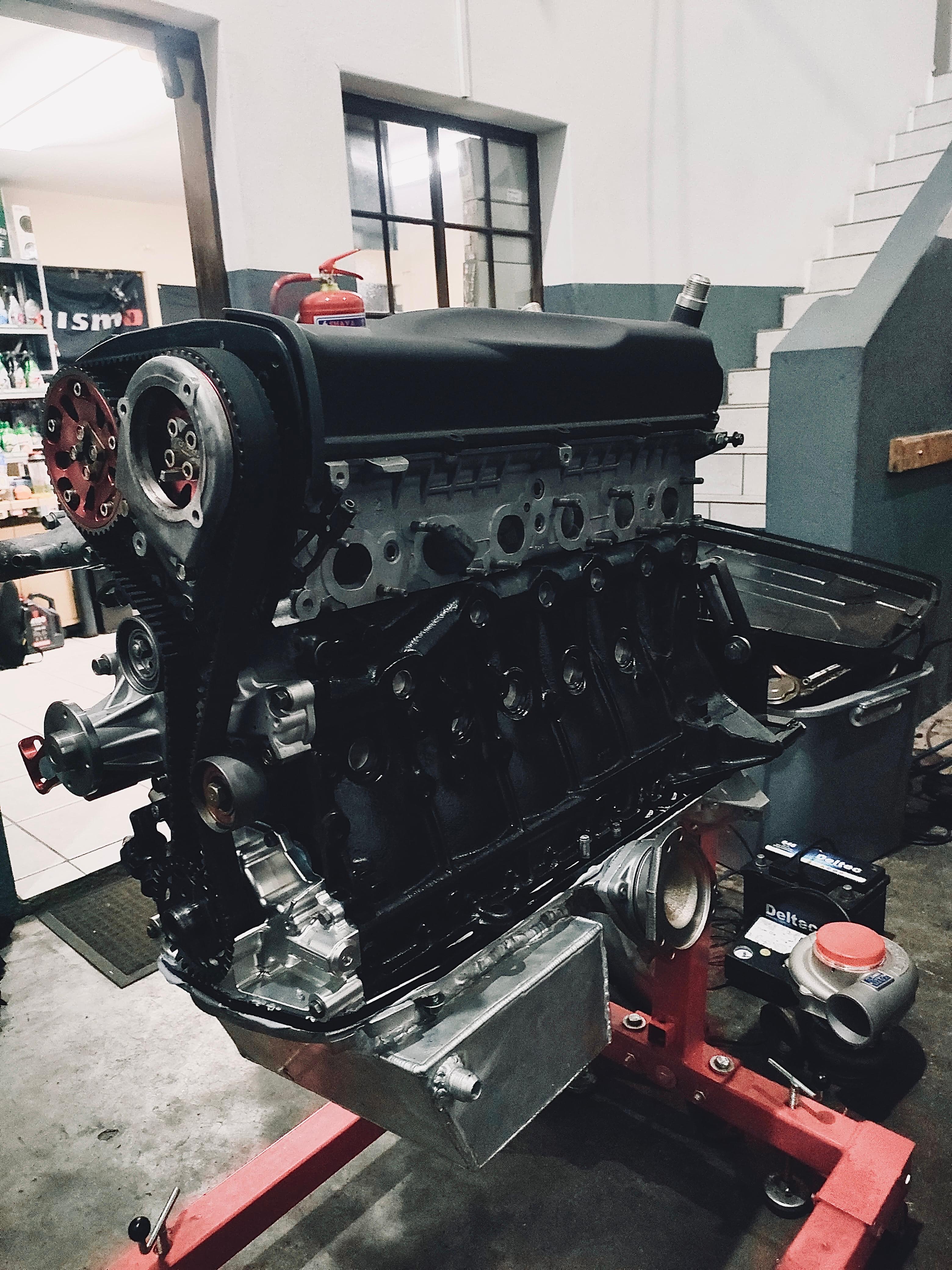 Japanese sports car in workshop lighting